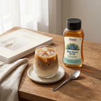 Fructo Blue Agave Syrup on rustic wooden table with latte