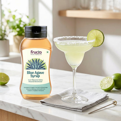 Fructo Blue Agave Syrup with margarita on marble counter