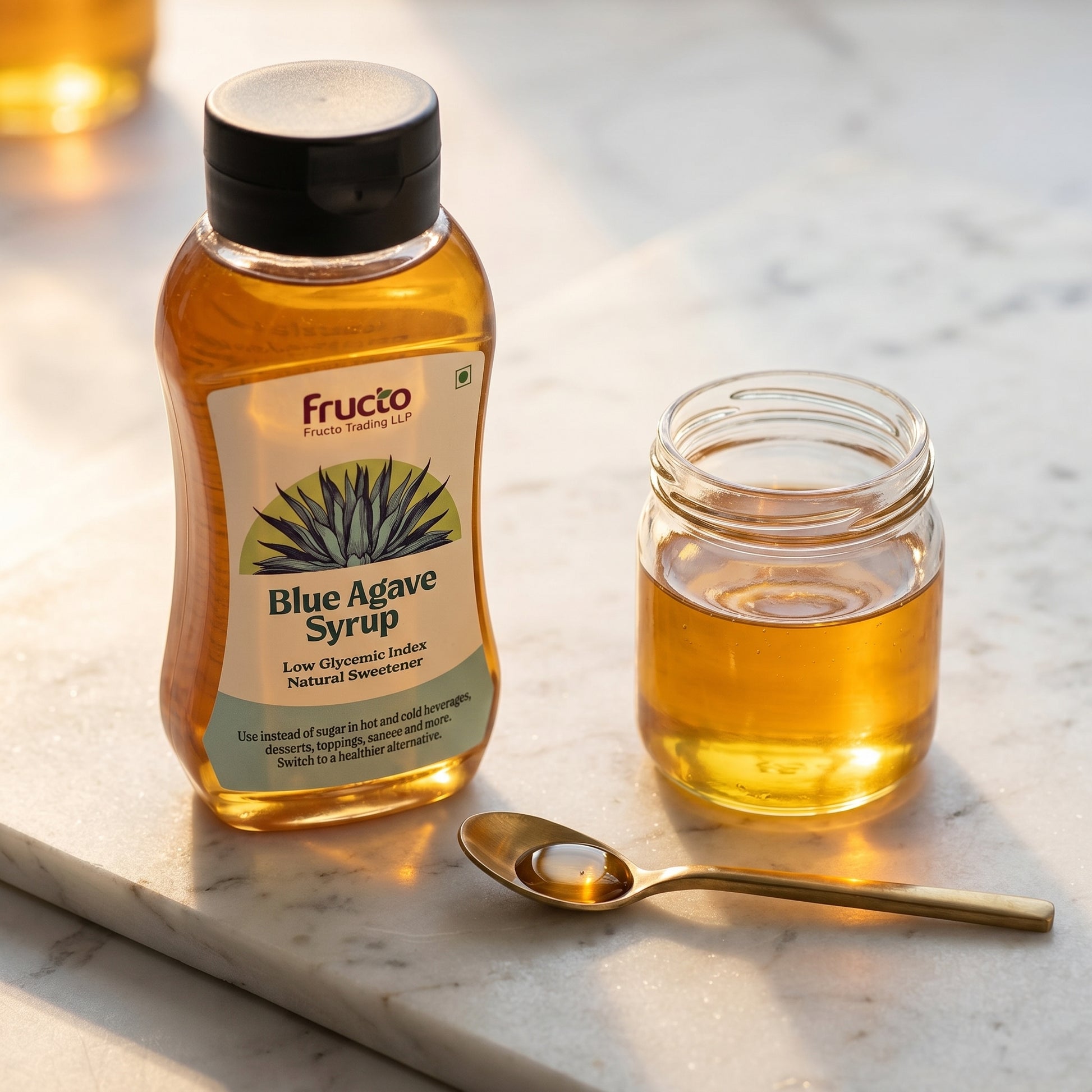 Fructo Blue Agave Syrup bottle with gold spoon and glass jar